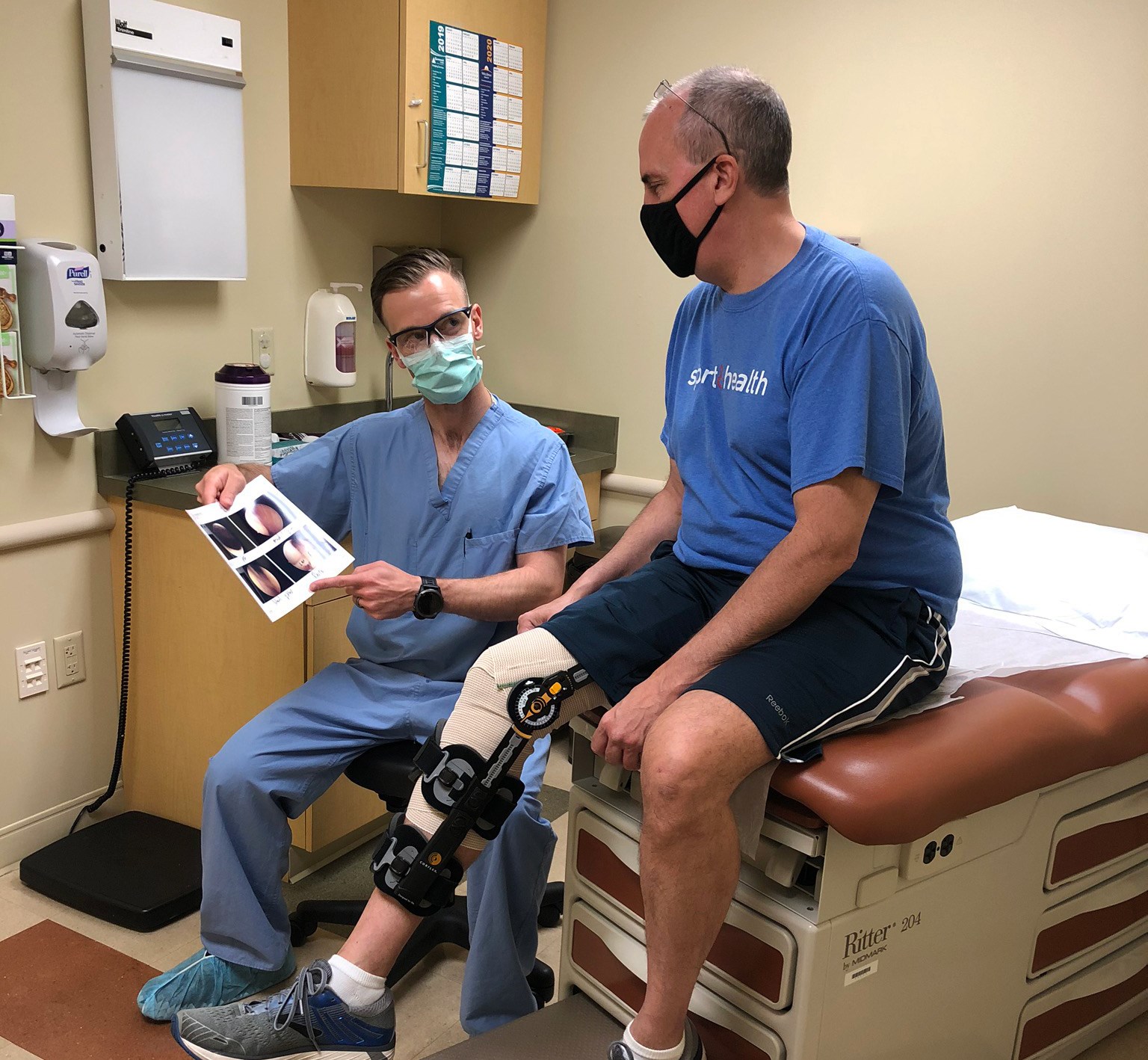 Michael Day, MD, an orthopedic surgeon with WellSpan Orthopedics in Chambersburg, reviews an image with Stephen Wilkinson of Shippensburg. Wilkinson had surgery in May to repair his right knee meniscus. 