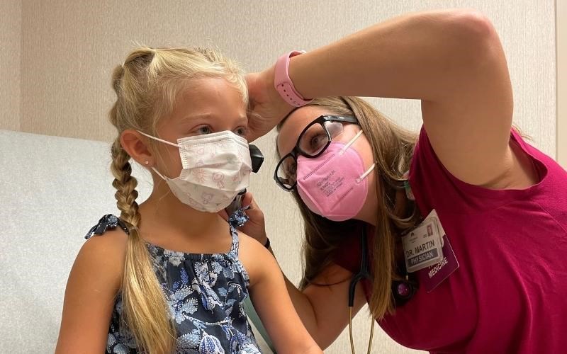 WellSpan family physician Dr. Ashley Martin examines Natalie Weller, who is going to kindergarten this fall, in Chambersburg.