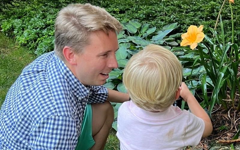 This summer, walk away from your screens to spend time outdoors with family and friends. WellSpan psychiatrist Dr. John Shand takes his son out to garden.
