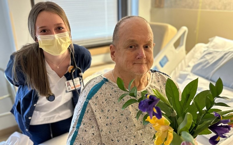 York College of Pennsylvania nursing student Madyson Knokey and WellSpan York Hospital patient David Lindner with his flower arrangement.