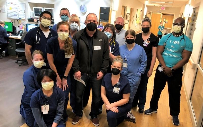 Nick Barakos (center, in black) with the intensive care team at WellSpan Ephrata Community Hospital. Below, Nick greets the team members, who are happy to see him doing so well.