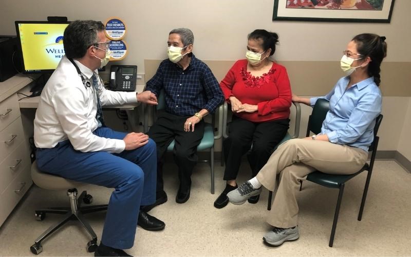 WellSpan physician Dr. Mark McKeague takes the hand of Ed Leviste, who is Filipino-American. With Ed is (from left) his wife, Rosie, and the couple's daughter, Christie Magsino, a WellSpan team member.