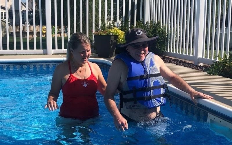 WellSpan physical therapist Deena Yuncker works with Todd Stiles in a pool, to provide exercise and bring him joy.