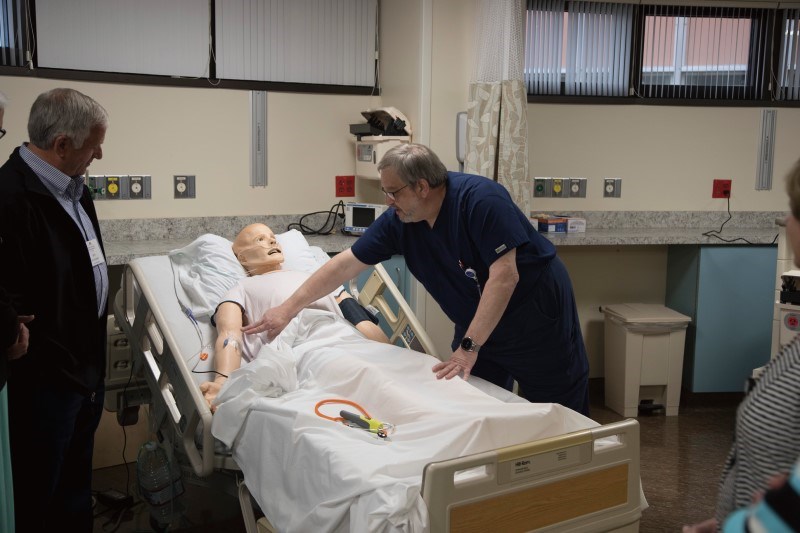 A WellSpan clinical staff member gets hands-on training with "Sim Man" in the Dart Foundation Clinical Simulation Lab