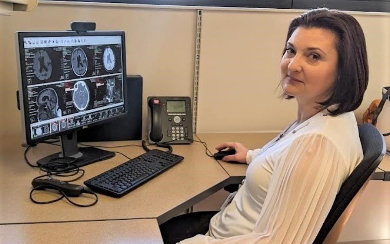 WellSpan neurologist Dr. Carolina Harbert looks at an MRI, one test physicians use to determine if a patient had a transient ischemic attack, which can be a stroke warning sign.